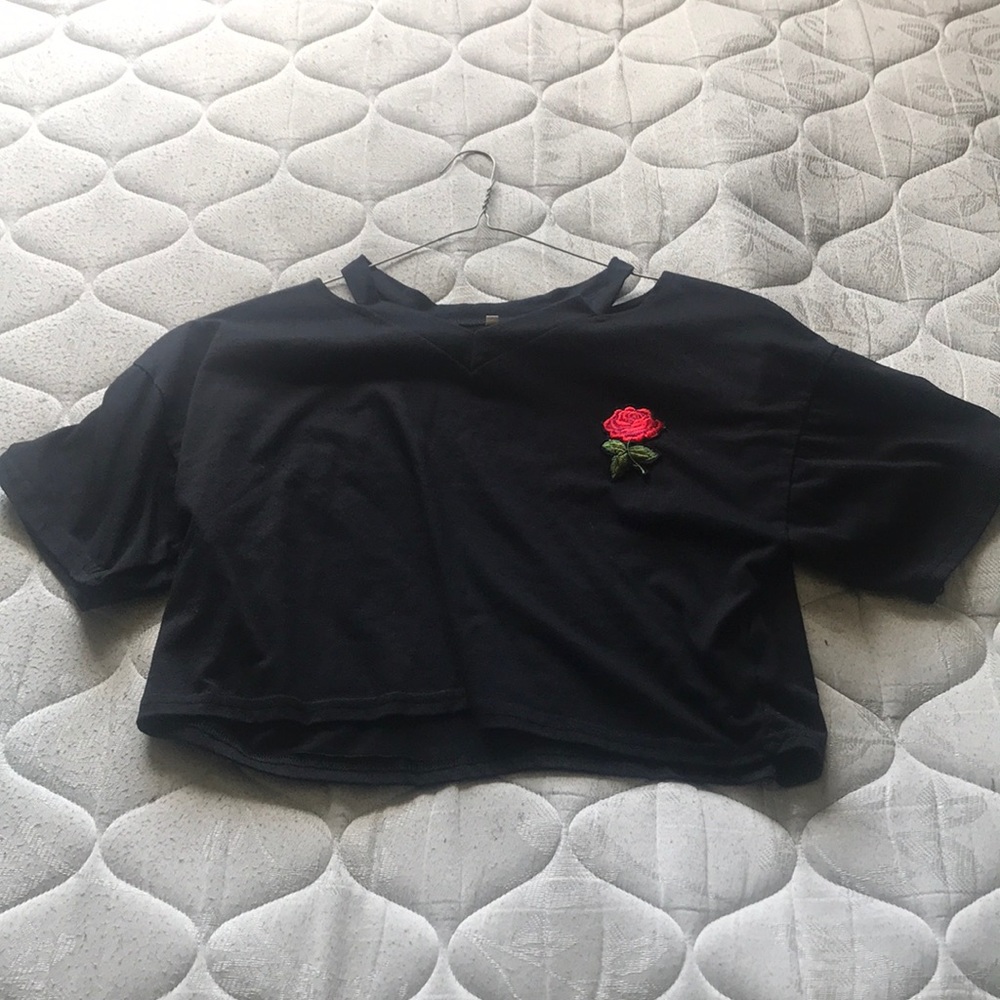 crops top with a rose on the chest area